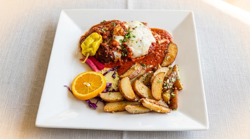 Lebanese stuffed eggplant with seasoned ground beef, marinara, and melted mozzarella at Phoenician Garden in Fresno