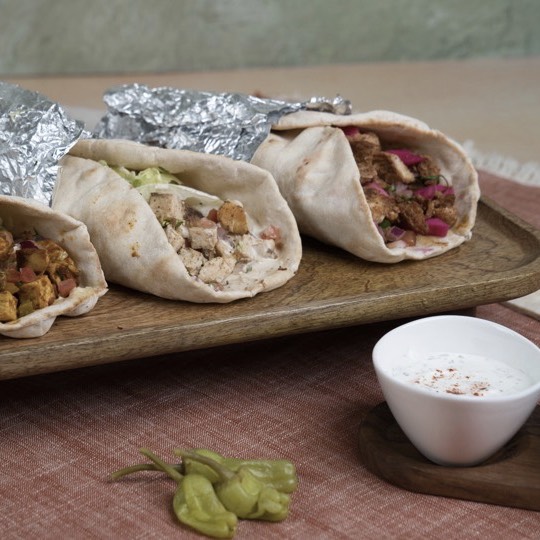 Phoenician Garden catering platter with Mediterranean wraps
