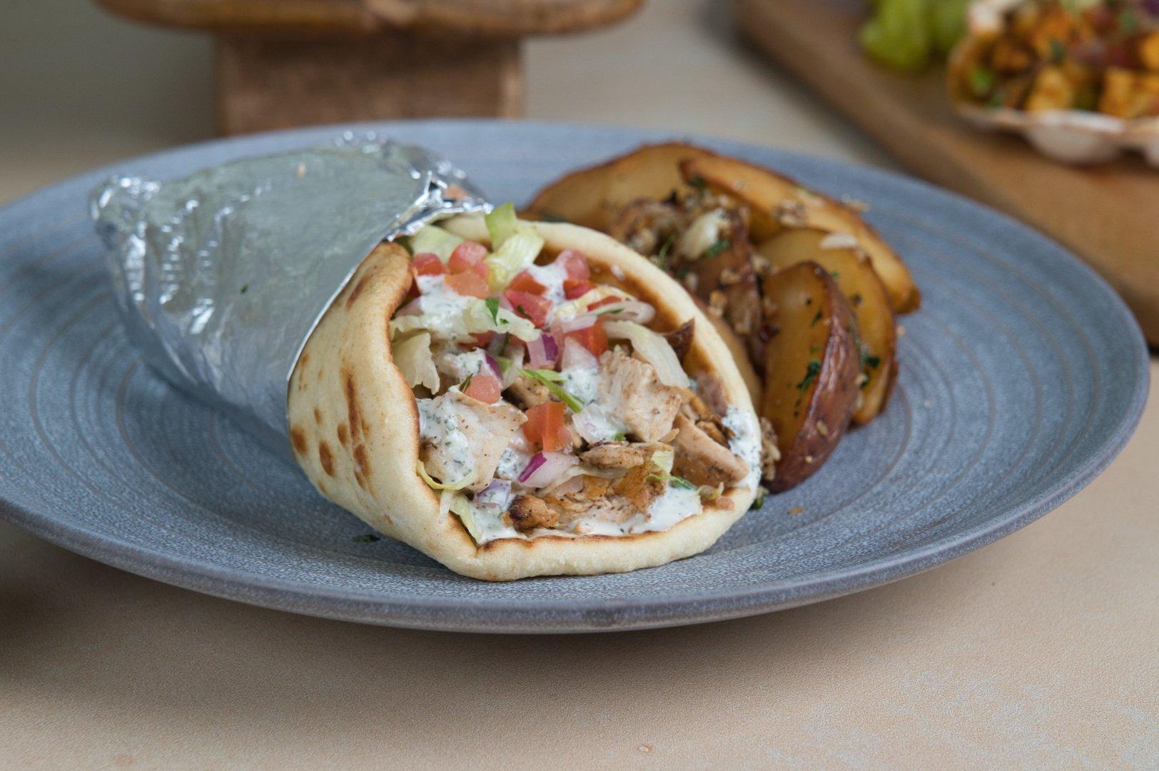Overhead view of gyro wrap with fresh vegetables at Phoenician Garden Fresno