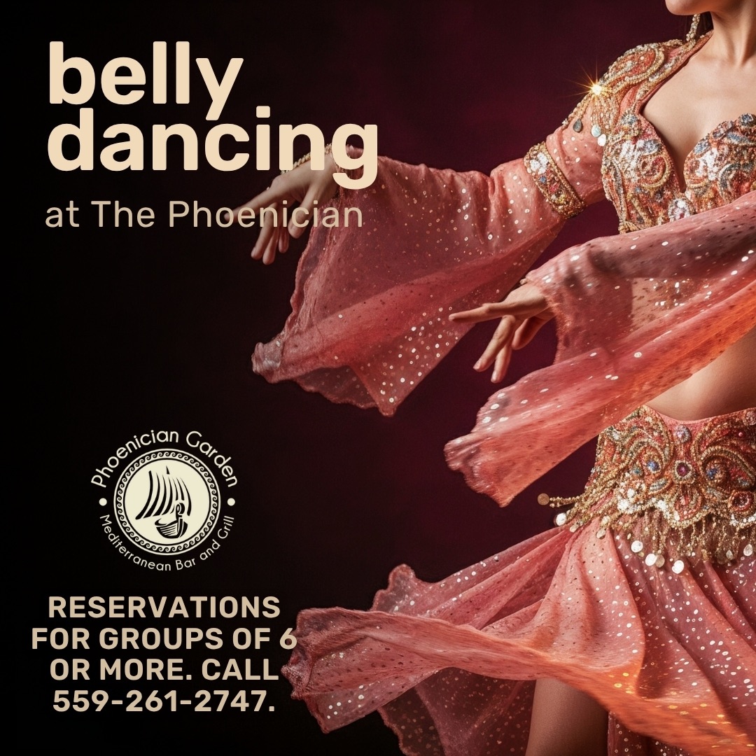 Live belly dancing night with guests dining at Phoenician Garden Mediterranean restaurant in Fresno