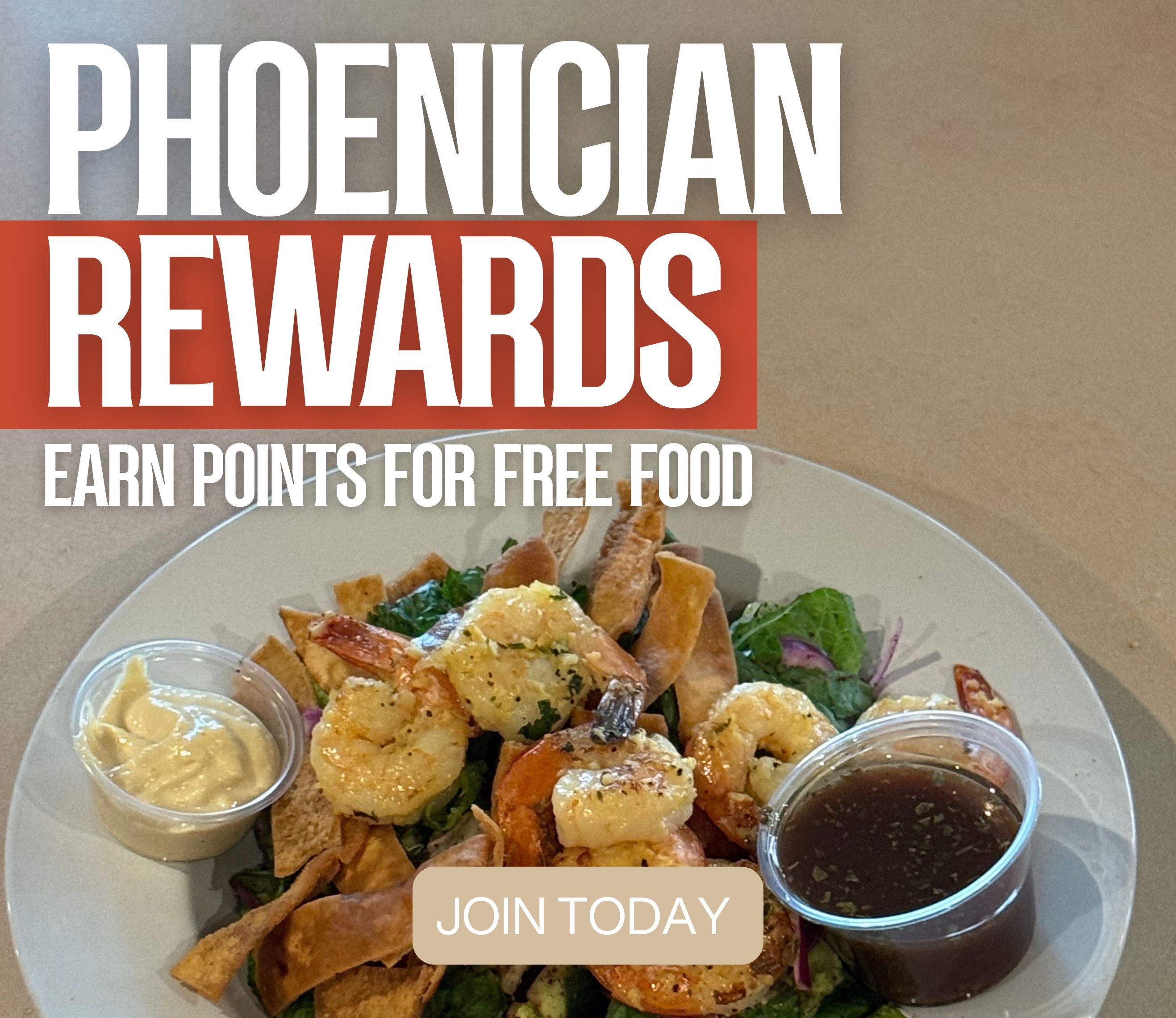 Phoenician Garden gift card surrounded by Mediterranean dishes and warm lighting